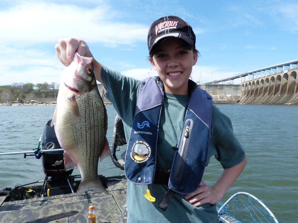 Taylor Barton shows off her success with tailrace fishing.